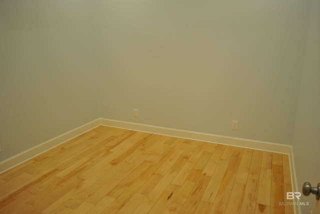 spare room with hardwood / wood-style floors