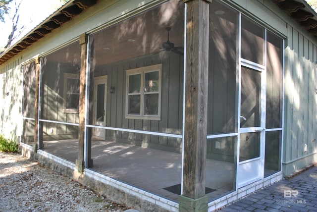 view of side of home with a sunroom