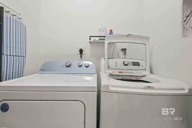 laundry room featuring laundry area and separate washer and dryer