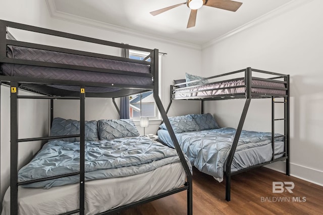 bedroom with crown molding, wood finished floors, baseboards, and ceiling fan