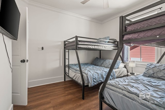 bedroom with wood finished floors, a ceiling fan, baseboards, and ornamental molding