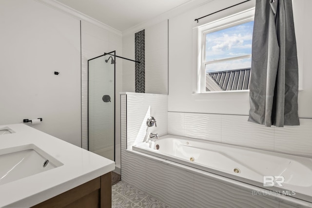 bathroom featuring a tub with jets, a walk in shower, vanity, and crown molding