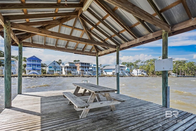 dock area with a residential view and a water view