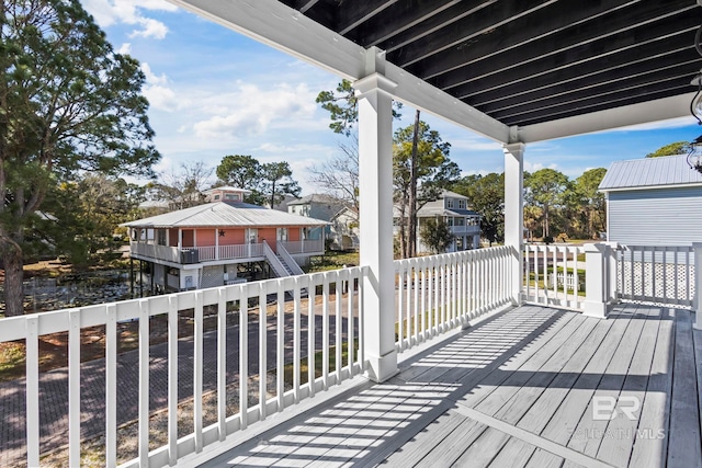 wooden terrace featuring a residential view