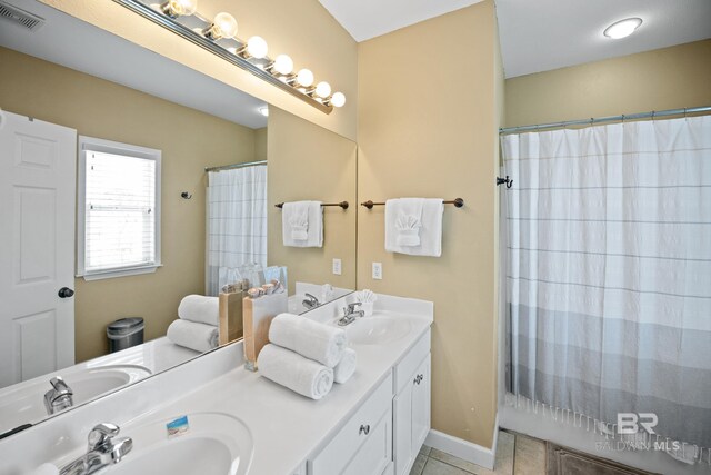 446 Harbor Light Cir, Gulf Shores, AL 36542 - bathroom featuring tile patterned flooring, double vanity, and a shower with curtain