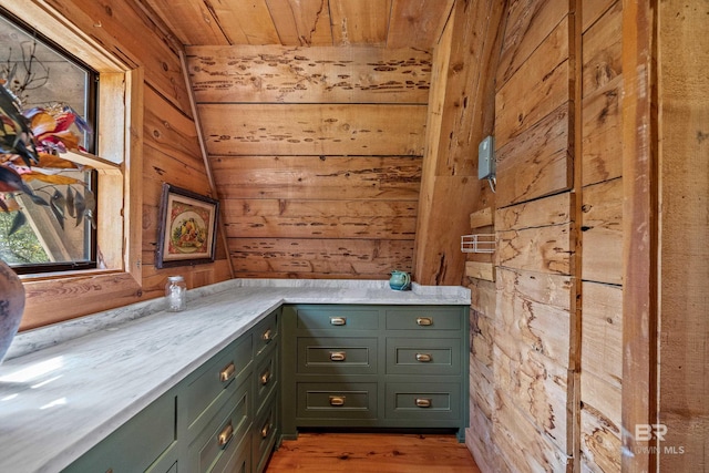 interior space with wooden ceiling, wooden walls, and light wood-type flooring