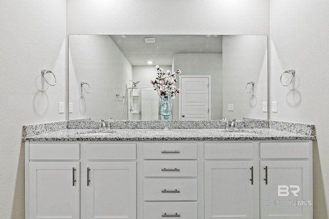 bathroom featuring vanity and walk in shower