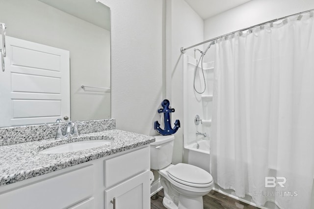 full bathroom featuring shower / tub combo, vanity, hardwood / wood-style flooring, and toilet