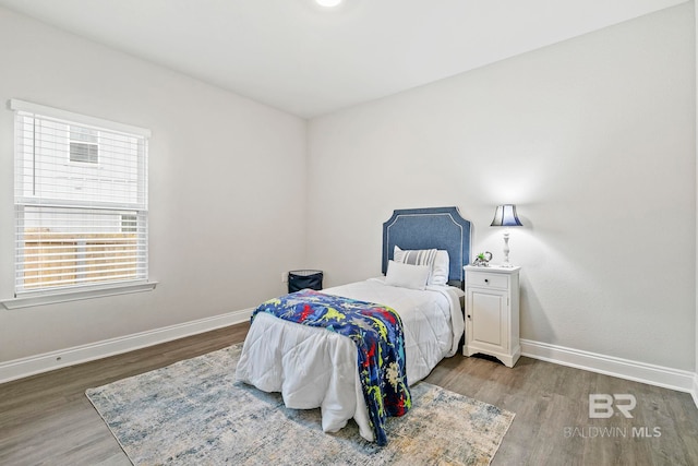 bedroom with wood-type flooring