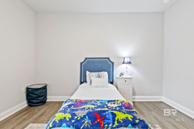 bedroom featuring hardwood / wood-style flooring