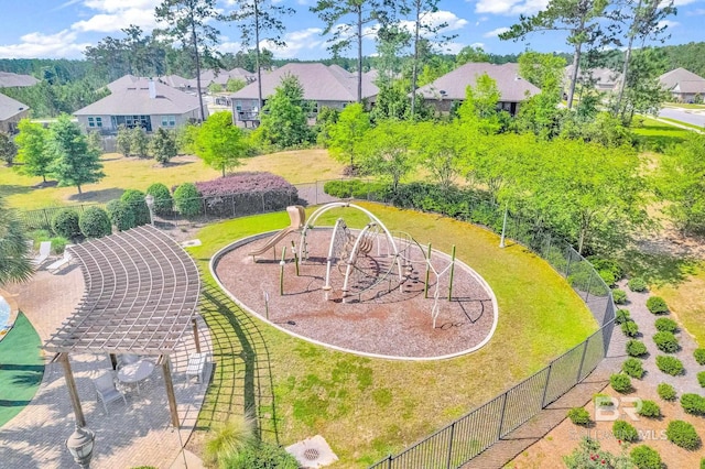 view of property's community with a playground and a lawn