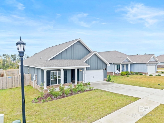 view of front of home featuring a front lawn and a garage