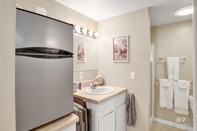 bathroom with tile patterned flooring, vanity, and a shower with shower door