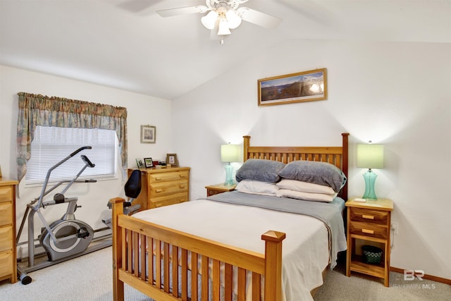 carpeted bedroom featuring lofted ceiling, ceiling fan, and a baseboard radiator