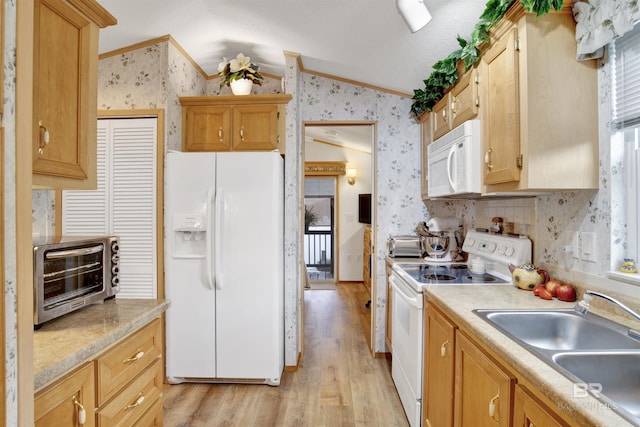 kitchen featuring white appliances, light wood-type flooring, ornamental molding, sink, and lofted ceiling