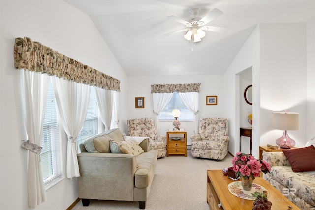 living room with ceiling fan, vaulted ceiling, and light colored carpet