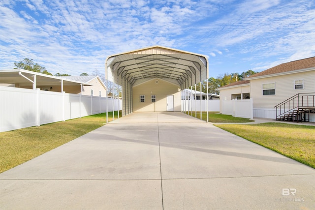 view of front facade with a carport and a front lawn