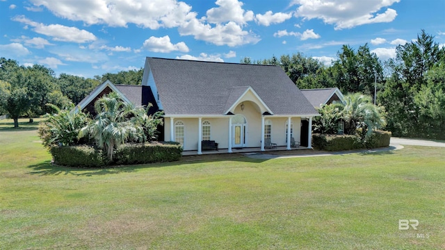 cape cod home with a porch and a front lawn