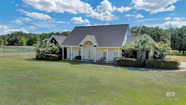 view of front of house with covered porch and a front yard