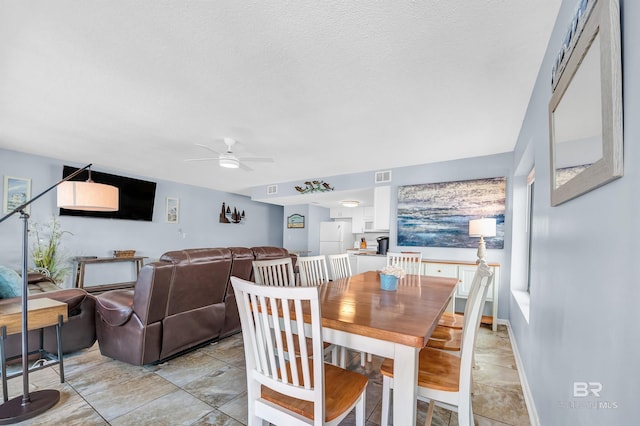 407 W Beach Blvd Unit 570, Gulf Shores, AL 36542 - dining space featuring a ceiling fan and a textured ceiling
