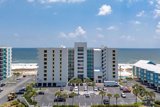 407 W Beach Blvd Unit 570, Gulf Shores, AL 36542 - view of property with view of water and beach and uncovered parking