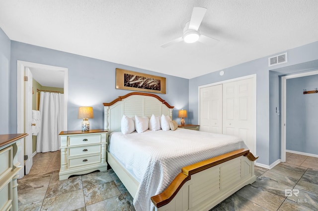 407 W Beach Blvd Unit 570, Gulf Shores, AL 36542 - bedroom with a closet, a textured ceiling, baseboards, and a ceiling fan