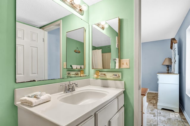 407 W Beach Blvd Unit 570, Gulf Shores, AL 36542 - full bathroom featuring vanity and baseboards