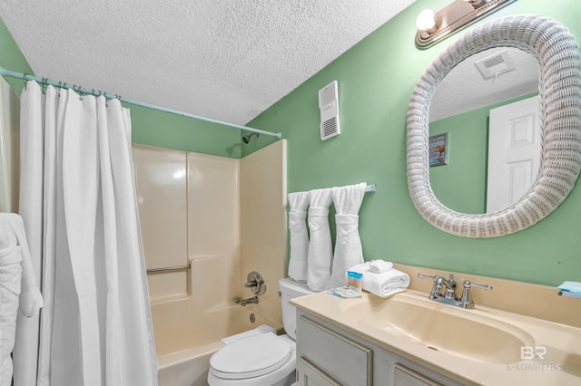 407 W Beach Blvd Unit 570, Gulf Shores, AL 36542 - bathroom featuring a textured ceiling, shower / tub combo, vanity, and toilet