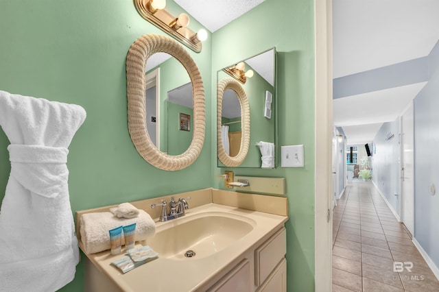 407 W Beach Blvd Unit 570, Gulf Shores, AL 36542 - bathroom featuring tile patterned flooring, vanity, and baseboards