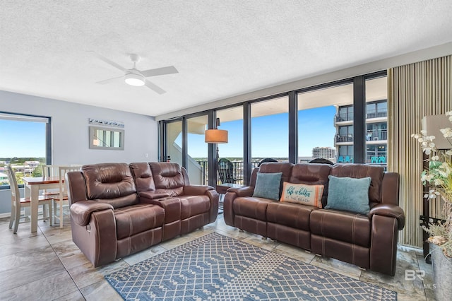 407 W Beach Blvd Unit 570, Gulf Shores, AL 36542 - living area with ceiling fan and a textured ceiling