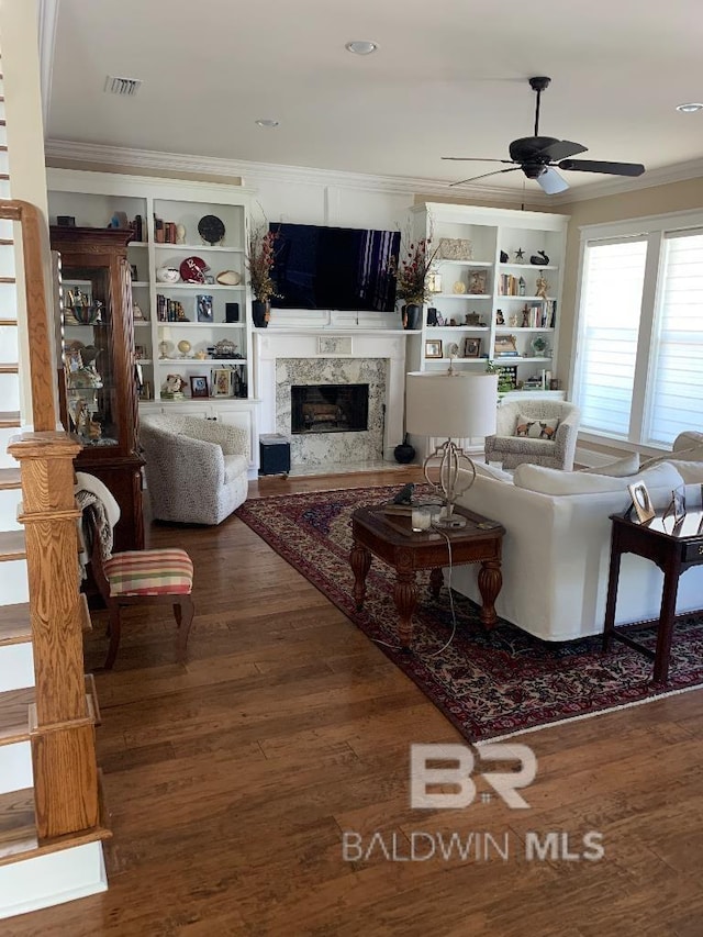 40 Bay Pointe Ct, Fairhope, AL 36532 - living room with crown molding, a high end fireplace, a ceiling fan, wood finished floors, and recessed lighting