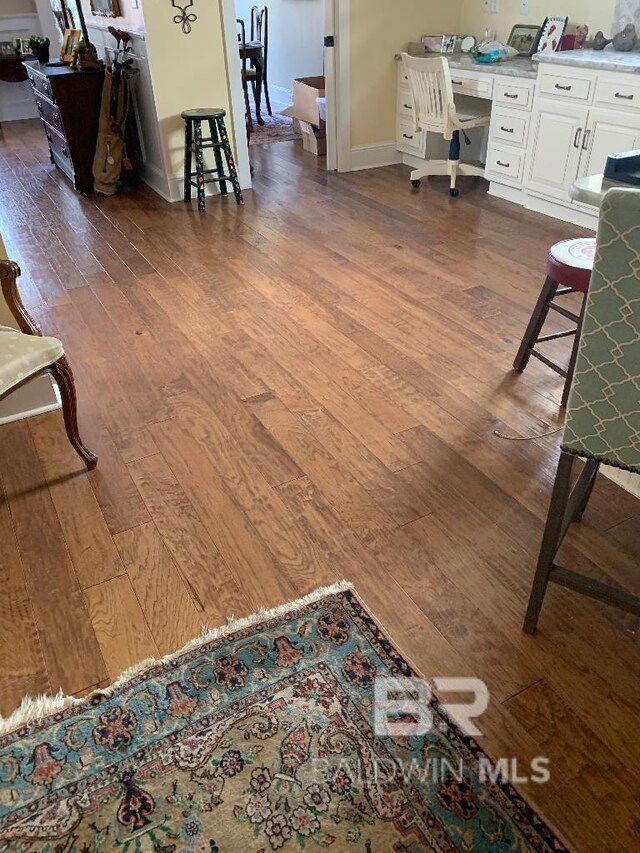 40 Bay Pointe Ct, Fairhope, AL 36532 - living room with dark wood-style floors, an office area, and baseboards