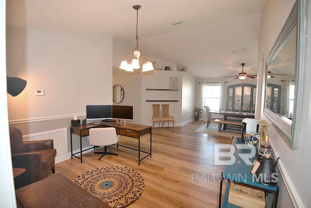 office featuring light hardwood / wood-style floors, ceiling fan with notable chandelier, and vaulted ceiling