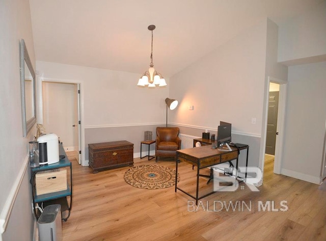 home office featuring a chandelier and light hardwood / wood-style floors