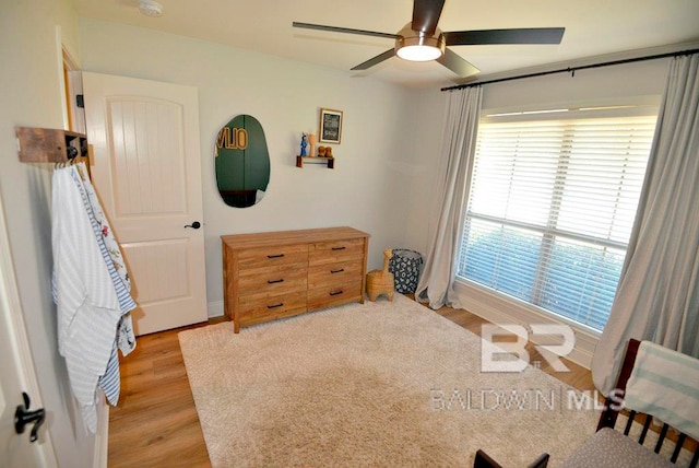 bedroom featuring ceiling fan and light hardwood / wood-style flooring