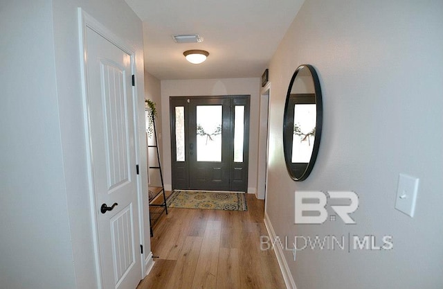 entryway with light hardwood / wood-style floors