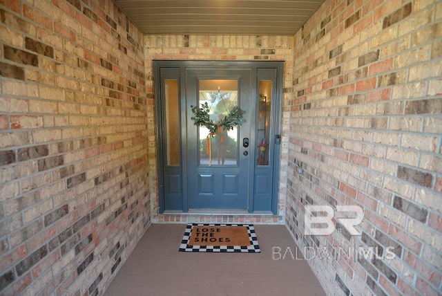 entrance to property featuring covered porch