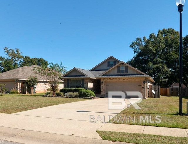 view of front facade featuring a front yard and a garage