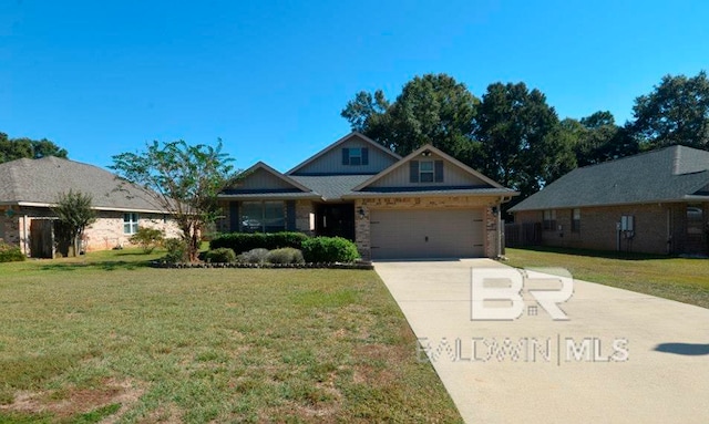 view of front of home with a garage and a front lawn