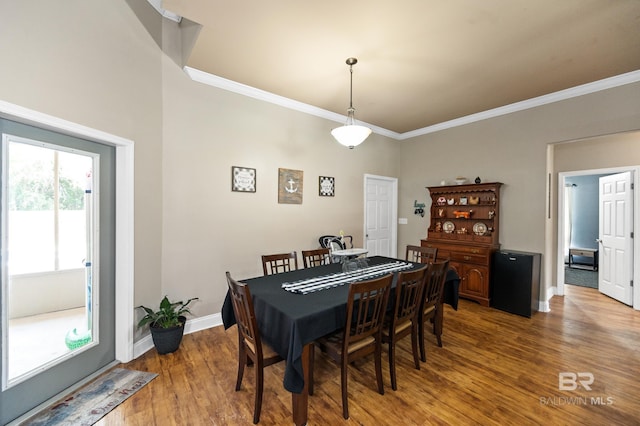 dining room featuring ornamental molding and hardwood / wood-style flooring