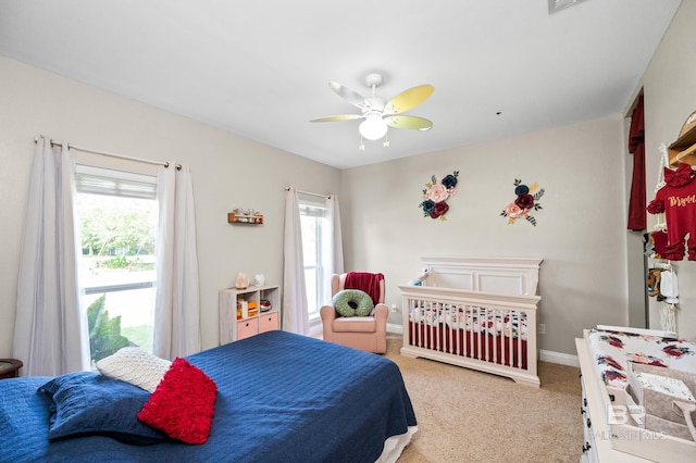 carpeted bedroom with ceiling fan