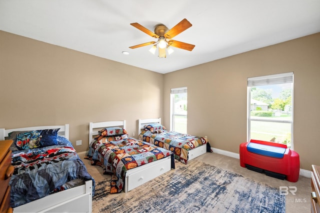 carpeted bedroom featuring ceiling fan