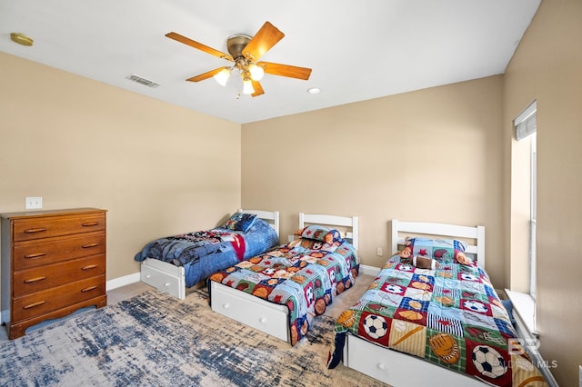 bedroom with ceiling fan and carpet floors