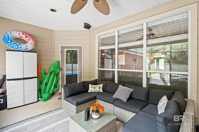 sunroom / solarium with ceiling fan and wood ceiling