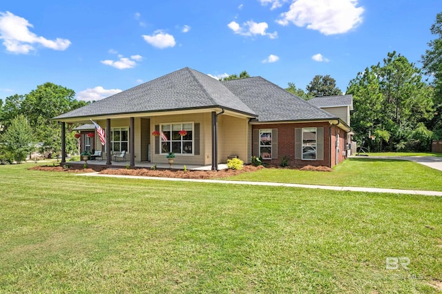 view of front of property with covered porch and a front yard