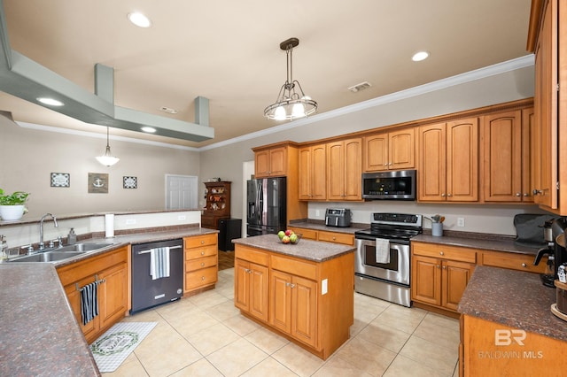 kitchen with decorative light fixtures, a center island, black appliances, light tile patterned flooring, and crown molding