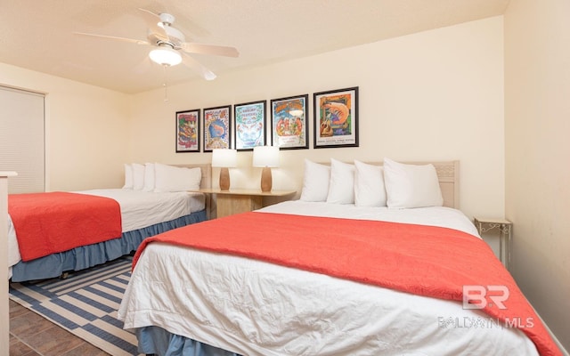 bedroom featuring wood-type flooring and ceiling fan