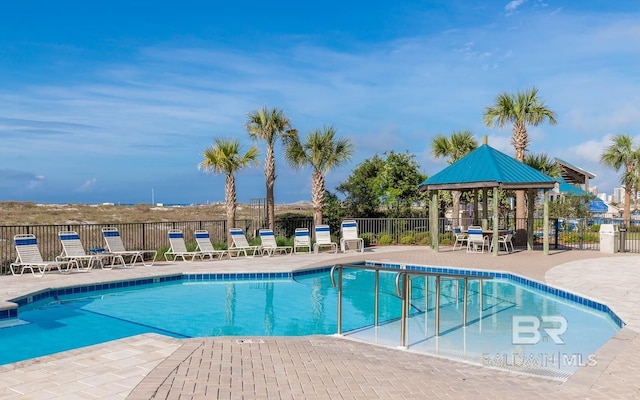 view of swimming pool featuring a gazebo and a patio