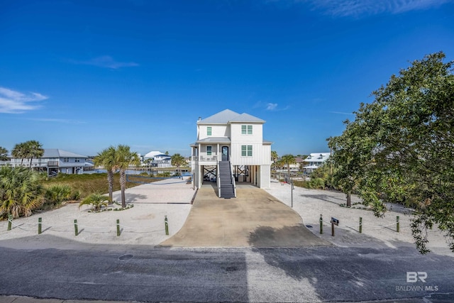 coastal inspired home featuring a carport