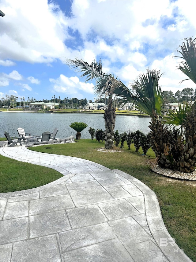 view of patio with a water view